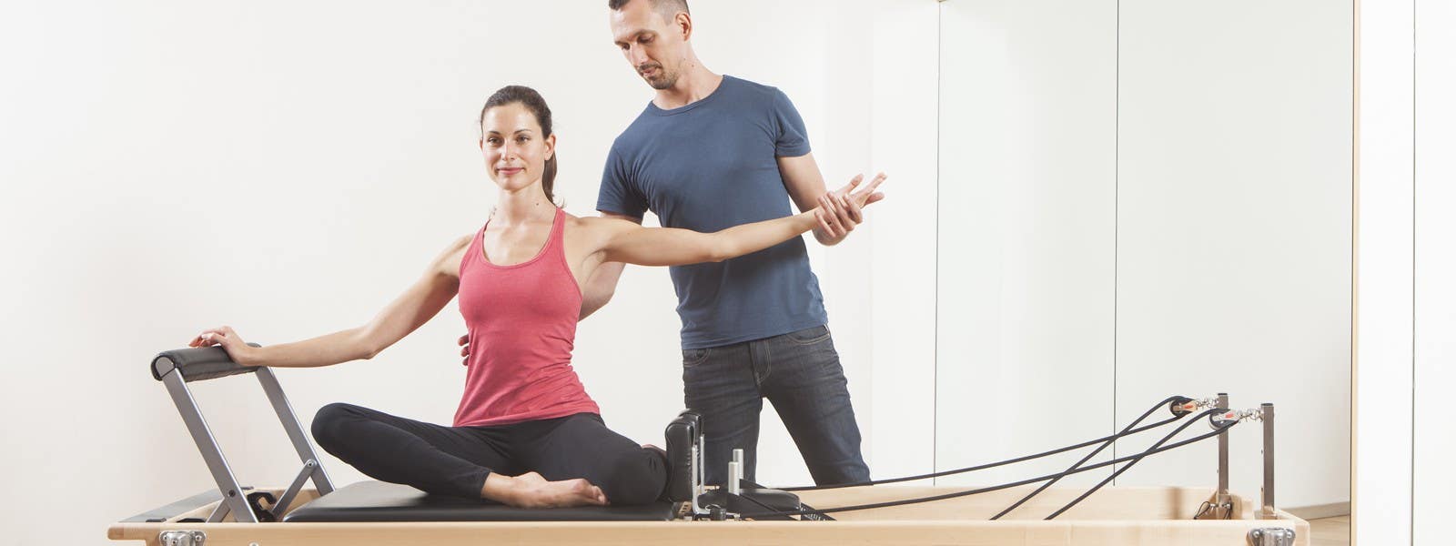 A Pilates instructor demonstrates how to 'turn on' your abs by BREATHING